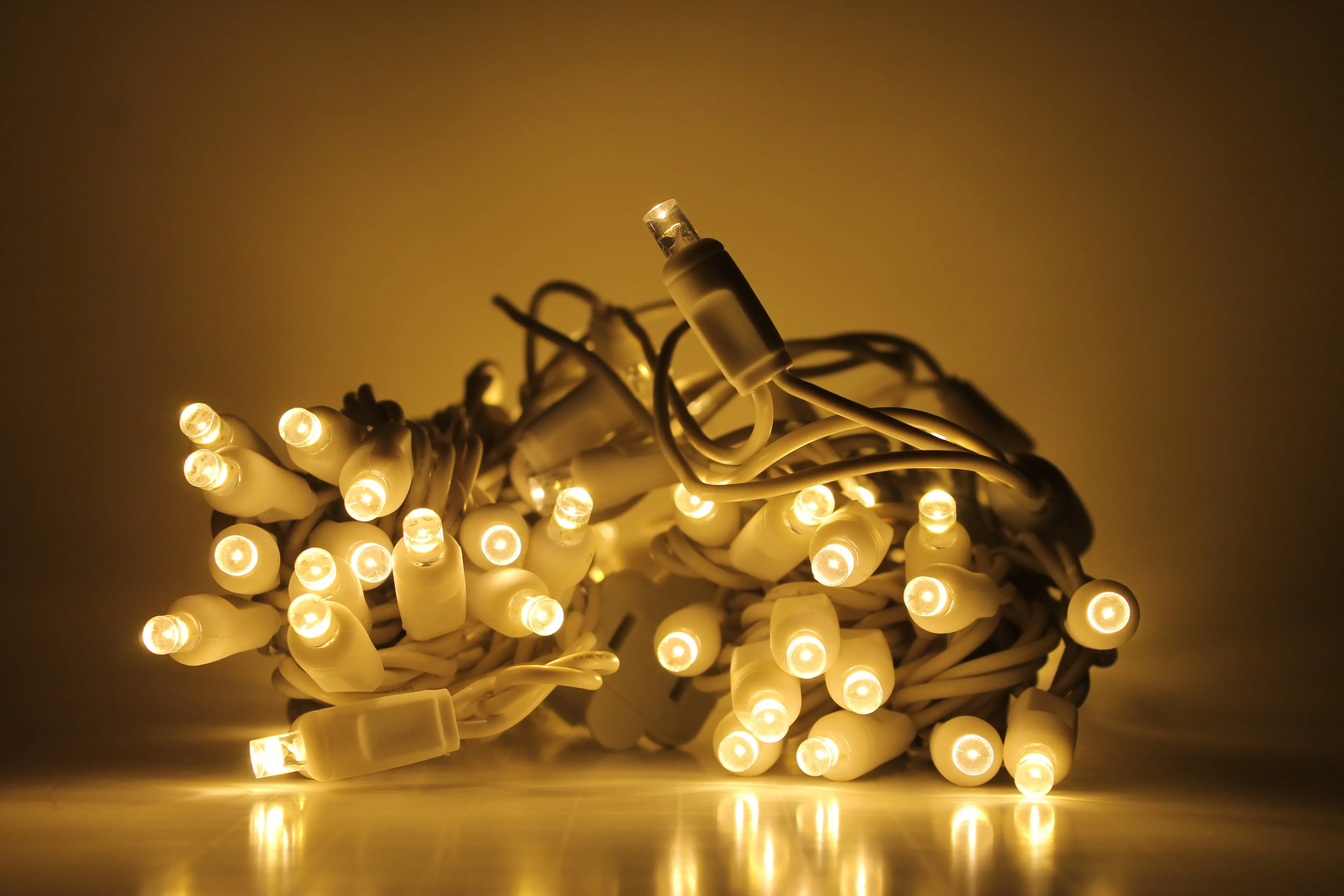 Outdoor LED Lighted Christmas Tree with a White Base and Clear White Tree Lights