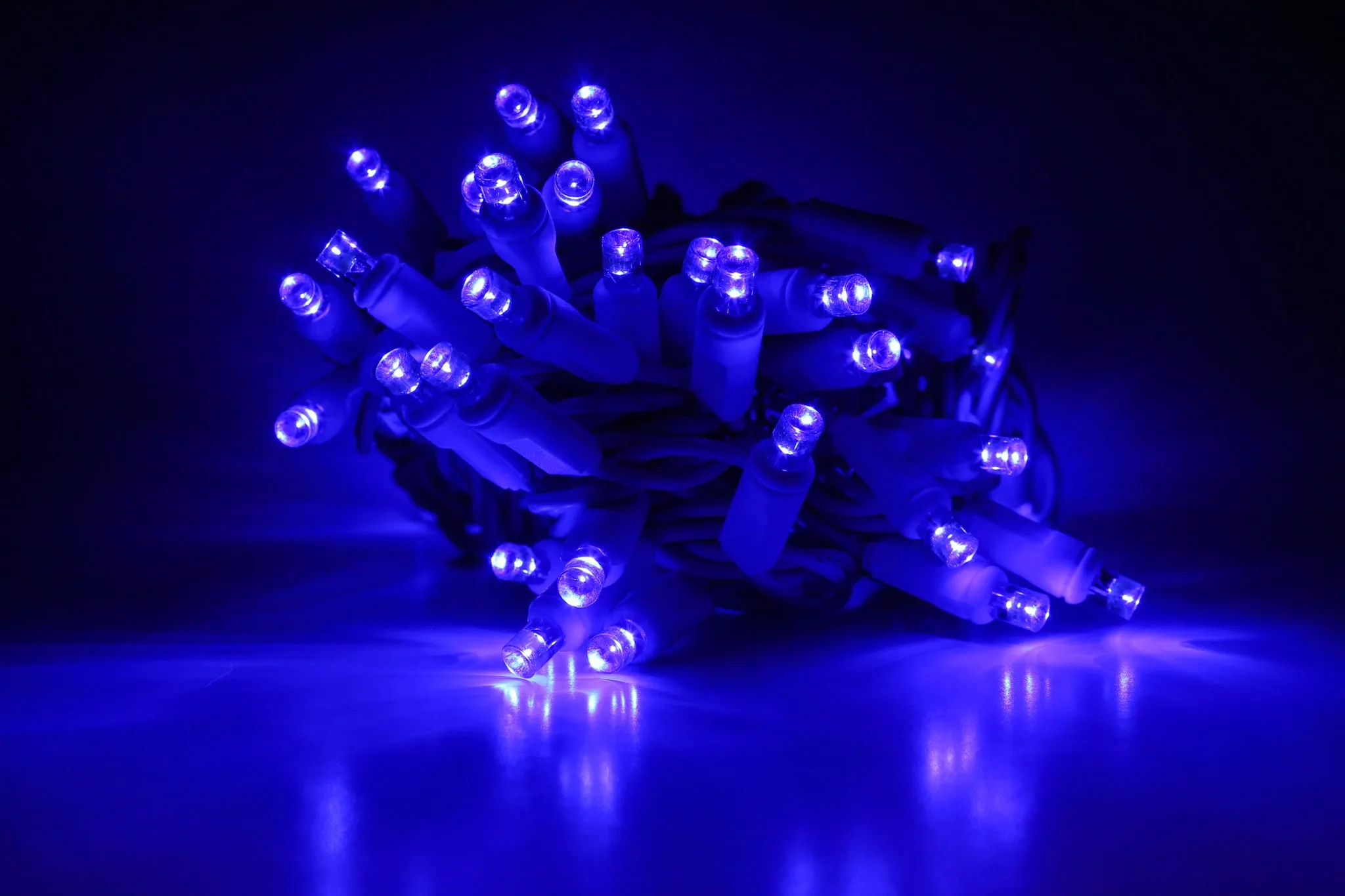 Outdoor LED Lighted Christmas Tree with a White Base and Clear White Tree Lights
