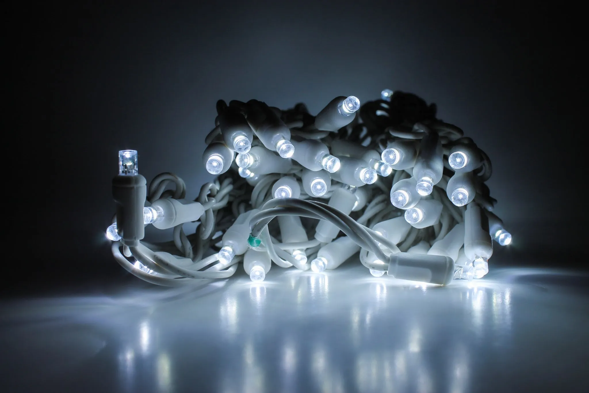 Outdoor LED Lighted Christmas Tree with a White Base and Clear White Tree Lights