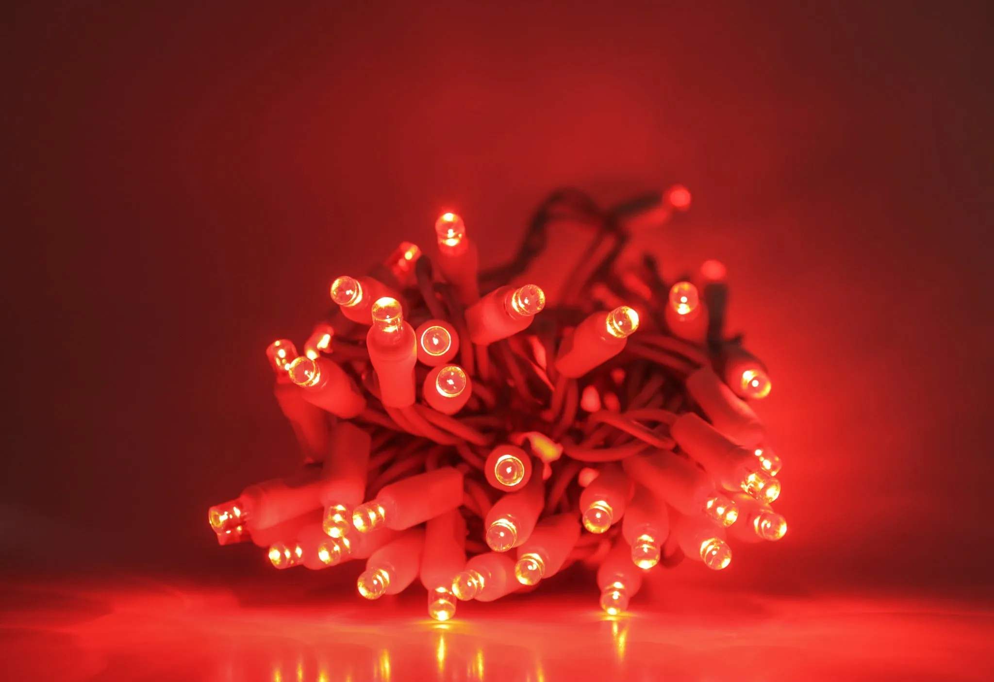 Outdoor LED Lighted Christmas Tree with a White Base and Red Tree Lights