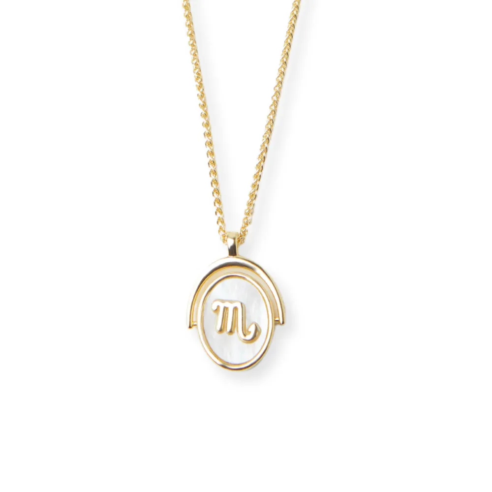 THE ZODIAC SPINNER NECKLACE